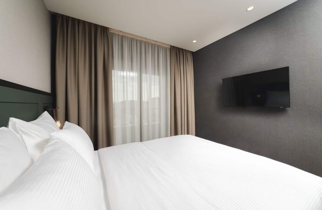 Relax in Spacious Room w/Balcony, City view & Free Parking in Prime location!
