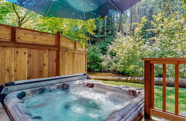 Riverfront property with three cabins, hot tubs, firepits, kayaks - beach access