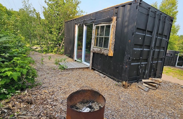Rustic shipping containers made into cozy cabins. Located U.P.'s Copper Country.