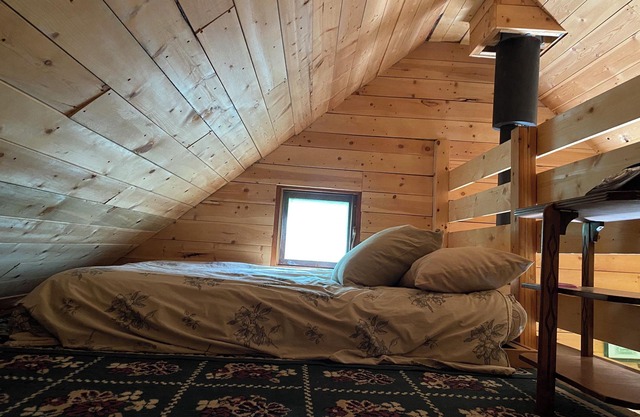 Rustic Solar cabin in the woods off grid glamming at its finest near Mara lake