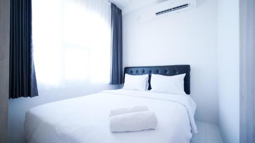 Simple and Comfortable Living 1BR at The City Square Apartment By Travelio
