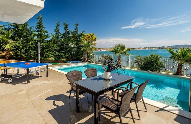 Situated in an enviable beachside location, overlooking the picturesque fishing harbour of Agios Sos