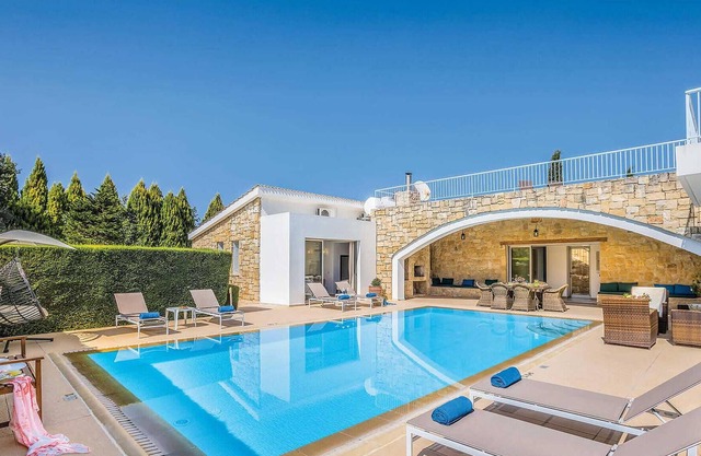 Situated in the inland region of Miliou, this stylish villa (which is next door to its sister villa