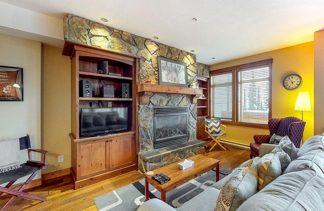 Ski-in/out village center condo with private hot tub & mountain views