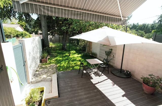 Small recent house with wooded garden