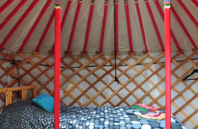 Small red yurt at Cabot Shores Wilderness Resort