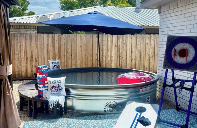 Speakeasy-game room, Gatsby-themed, heated stock tank pool