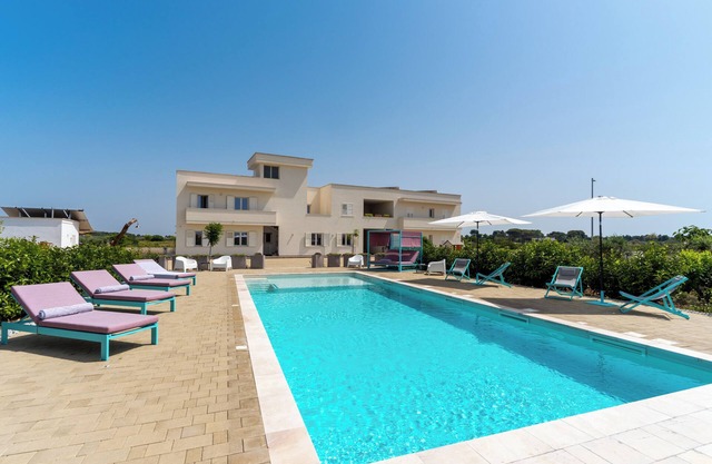 Studio Apartment "Le Scuderie 9" with Balcony, Shared Pool & Wi-Fi