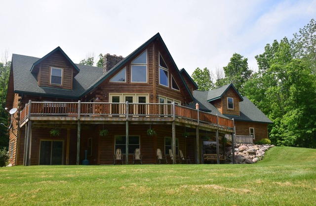 Stunning Log Cabin on 65 Acres with a new swimming pool