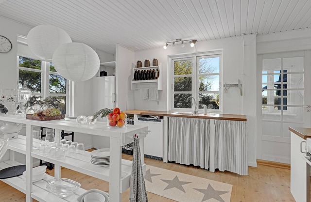 Stylish living in this large vacation home in Østermarie on the island of Bornholm.