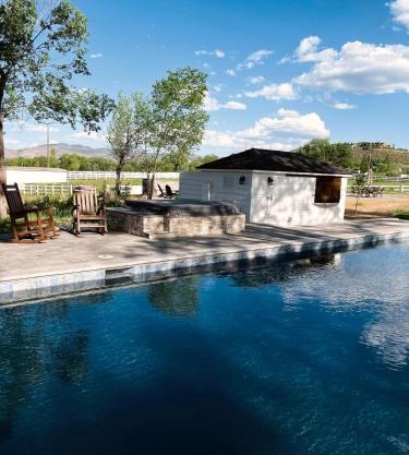 The Ranch House with a Pool Hot Tub and Fire Pit