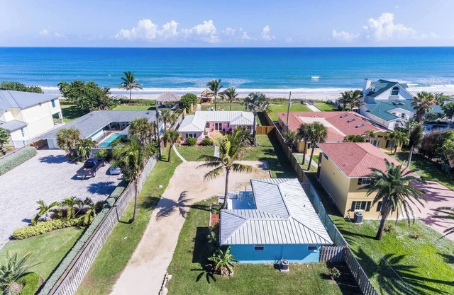 This house is a 4 bedroom(s), 3 bathrooms, located in Indialantic, FL.