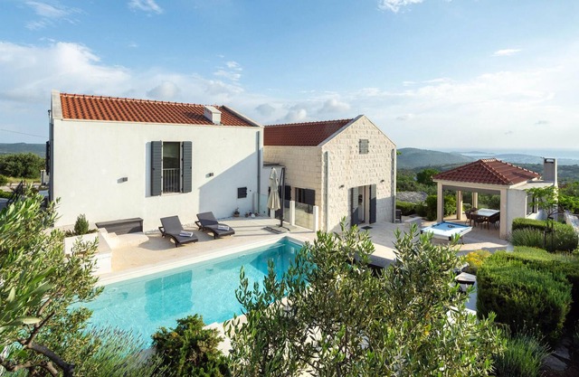 This modern and bright vacation home is located in a small village in the hinterland of Rogoznica.