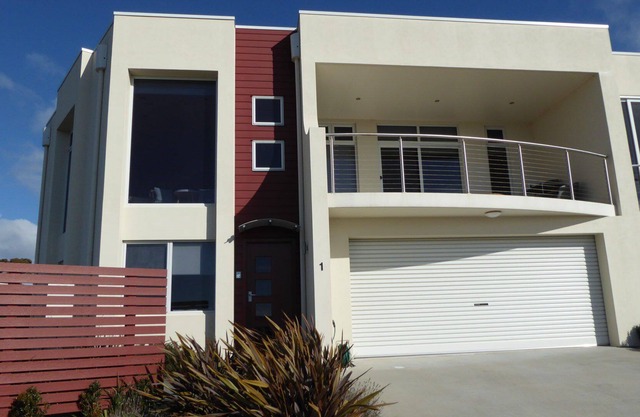 This stunning, split level town house is in the box seat at Bridport with...