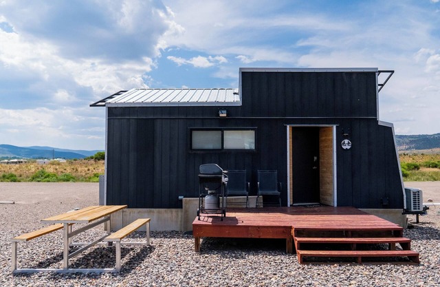 This Tiny Home is custom made by a Colorado craftsman has one Queen bed in loft accessible by stairs and also has a fold out Full futon on main level. Sleeps up to 4. Please note, this home does have a sleeping area in a loft. If you require an accom