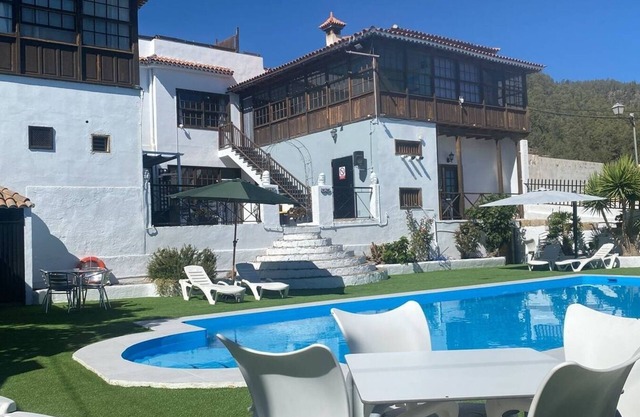 This twin room has two single beds with a private separate bathroom (bathroom across the hallway). The view is of the whole garden area and the sea can be seen on clear days.