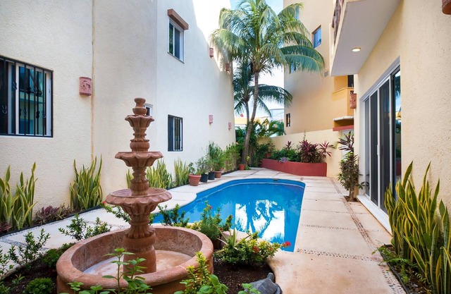 Two bedroom bottom floor condo 1/2 block to the beach