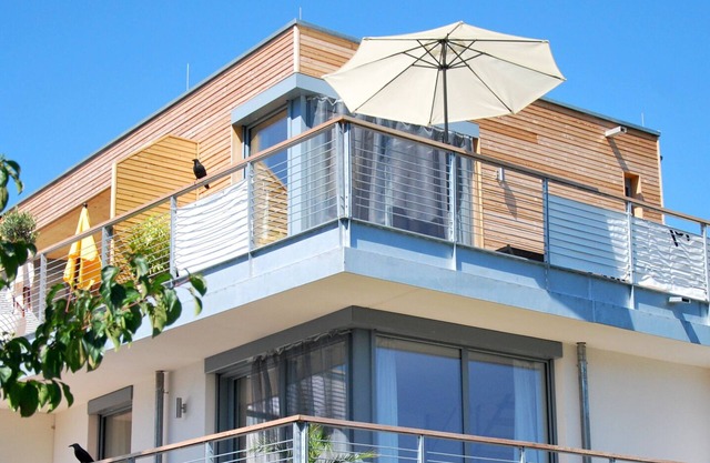 Vacation apartment Am Landesteg - exclusive maisonette with 2 balconies by the lake