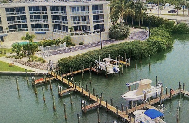 Waterfront Condominium - One minute from the beach. Pool & Hot Tub