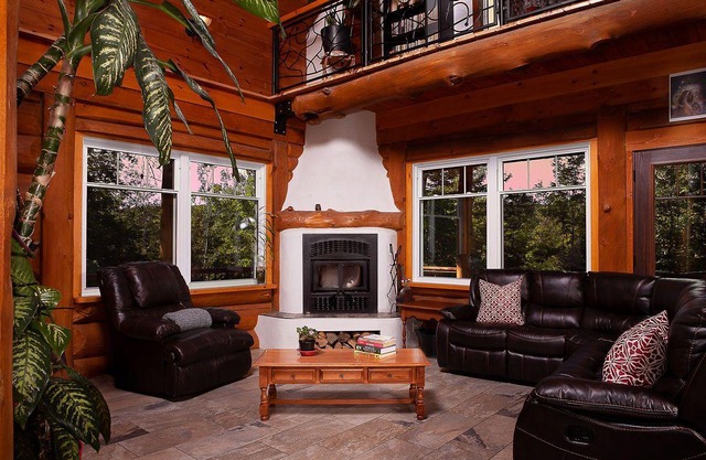 You’ll be charmed by this stunning log cabin perched on the mountainside.