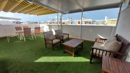 Canet de Berenguer Apartment | Stylish Duplex with Ocean Views and Pool Access