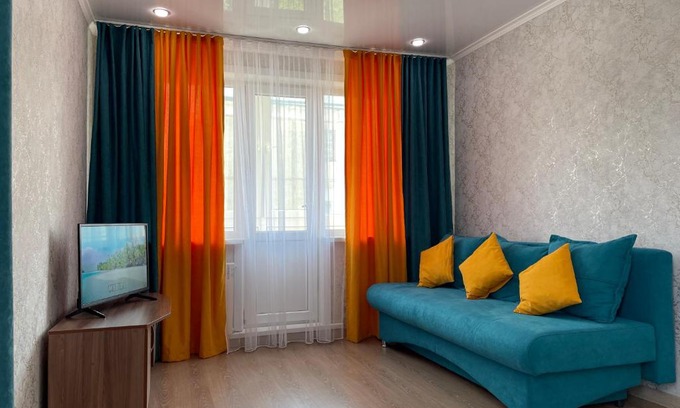 Petropavlovsk Apartment | Modern Apartment with Double Bed & Child-Friendly Amenities