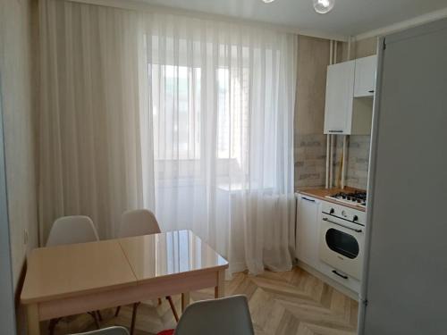 Uralsk Apartment | Discover Кунаева 64: Child-Friendly Stay with Great Reviews