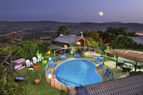 Vered Hagalil Cabin | Nature's Oasis Resort: Family Cabins with Pool & Hot Tub
