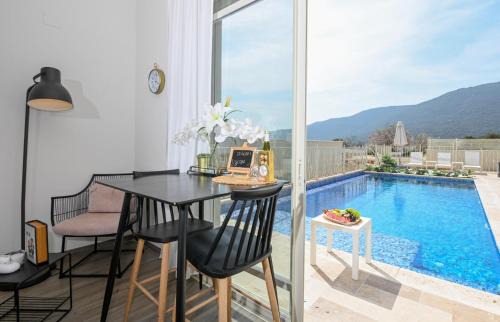 Safsufa Apartment | Peak Suites: Unforgettable Stays with Pool & Ocean Views