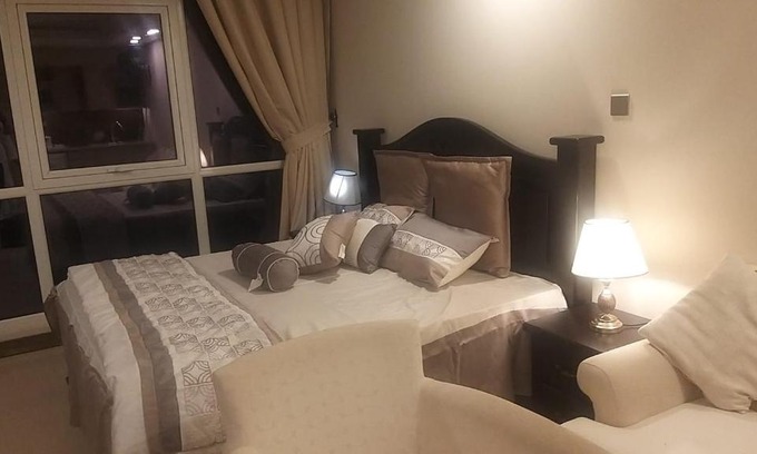 Muharraq Apartment | Discover برج بلس: A Relaxing Stay with Pool Access