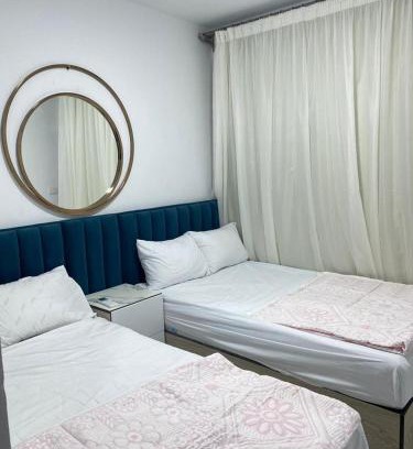 Al-Manasrah Apartment | Tranquil Room and Hall at Porto Said Resort with Ocean Views