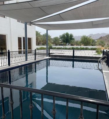Wadi Bani Kharus Hotel | Relax at Cloudinn: Oceanfront Escape with Pool Access