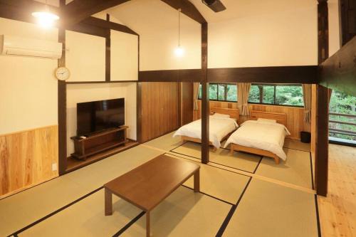 Minamiaso House | Relaxing Retreat at コテージくぎの with Open-Air Hot Springs