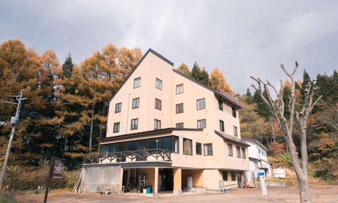 Yuzawa Cabin | Convenient Getaway at 豊島ロッヂ with Hot Tub & Dining