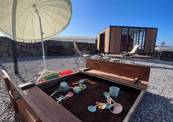 Hallim Apartment | Explore 하솜별담: Relax by the Inviting Pool