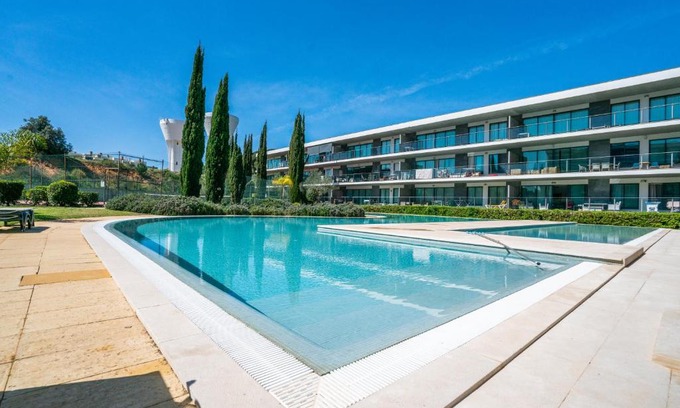 Vilamoura Apartment | Experience a Poolside Retreat with Balcony & Tennis Access