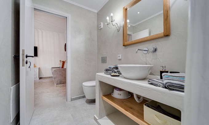 Akrotiri Apartment | Roomy 1 Bedroom Cycladic House Steps from Caldera Beach