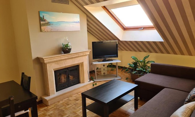 Distrito Oeste Apartment | Cozy Ático with Garage and Fireplace by the Beach