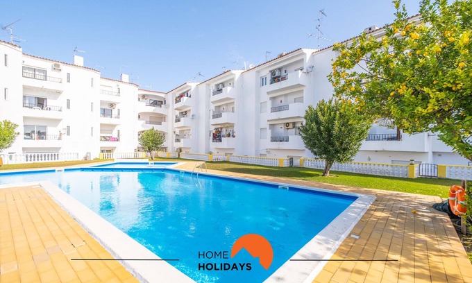 Areias de Sao Joao Apartment | New Town Retreat: Shared Pool, Balcony & Top-Rated Stay