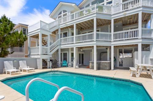 Ocean Sands House | Wave Rider: Steps to the Beach with Pool & Spa Access