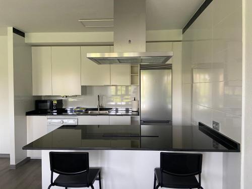 Distrito Sur Apartment | Modern 173A Apartment: Family-Friendly Retreat with Top Ratings