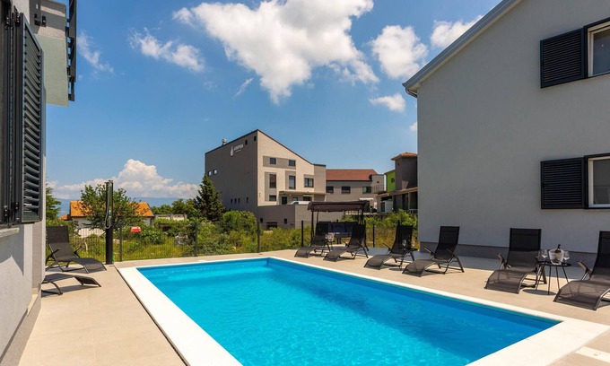 Vrbnik Apartment | Modern Apartment with Community Pool and Ocean Views