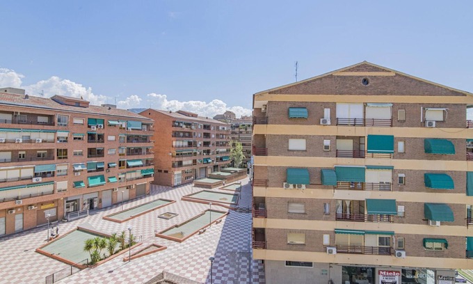 Chana Apartment | 2-Bedroom Retreat with Terrace in Granada - Steps from Metro and Bus