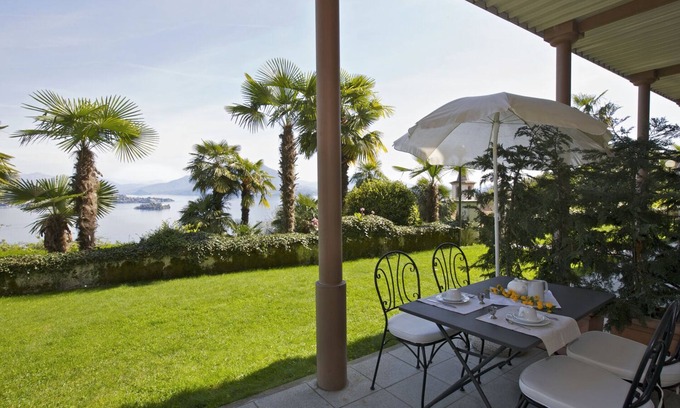 Carciano Apartment | 2-room apartment with terrace and garden in an Art Nouveau villa with communal pool