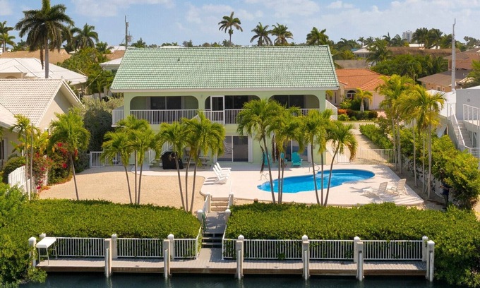Coury House | Impressive 7-Bedroom Home with Private Pool & Dockage