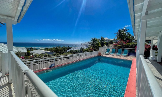 Anse des Rochers Villa | Idyllic Escape: Steps from the Sea with Oceanfront Views