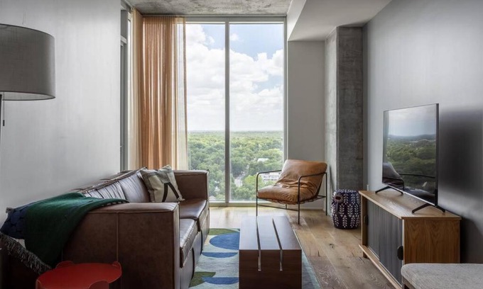 Rainey Street Historic District Apartment | Elevated Condo with Pool on Rainey Street by Locale