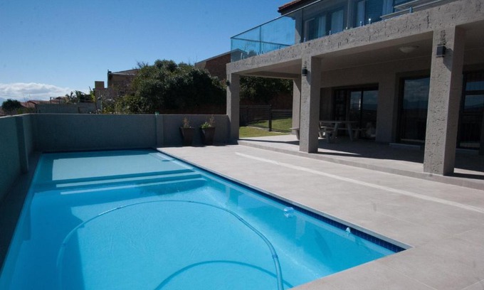 Hartenbos Apartment | Oceanfront Bliss at 25 On Rooiels - Rated 9/10 by Guests