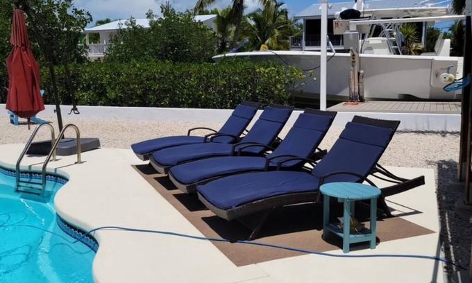 Breezeswept Beach Estates House | Exquisite Two-Story Home with Pool & Dock Access