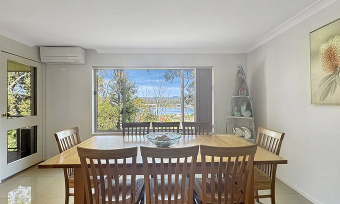 North Batemans Bay Apartment | Serene 3 Bed Retreat Amidst Treetops in Batemans Bay